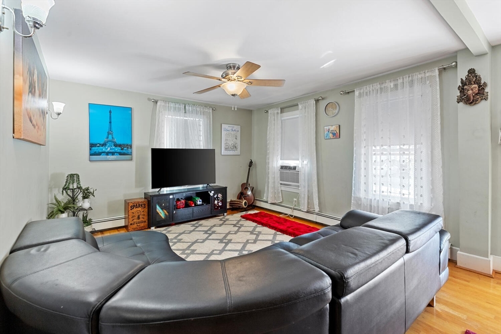 81 Everett Street Everett, MA 02149 - Photo 8 of 37 a bedroom with a bed and a flat screen tv