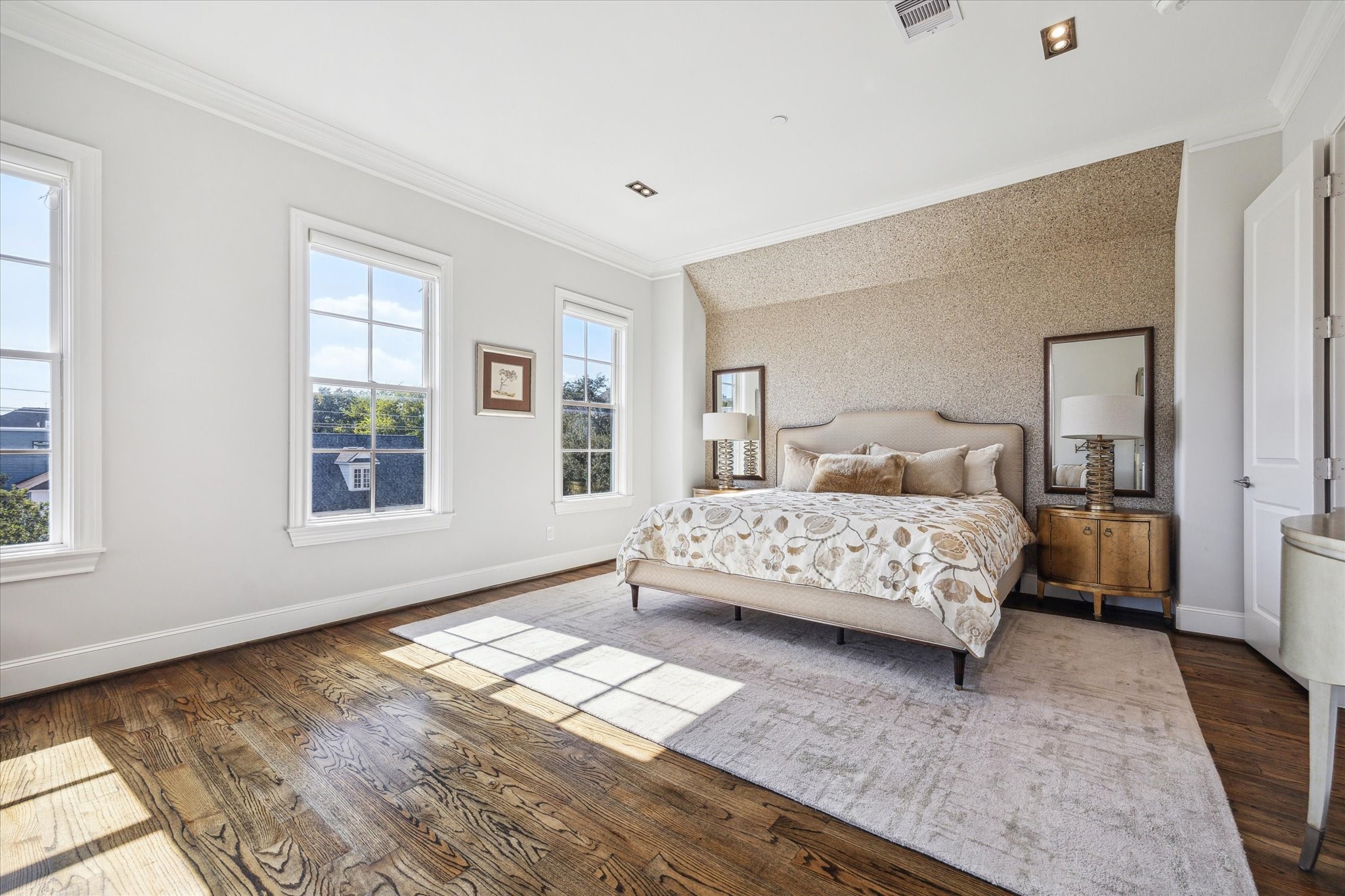 1619 Calumet Street Houston, TX 77004 - Photo 16 of 26 a bedroom with a bed lamp on desk and a window
