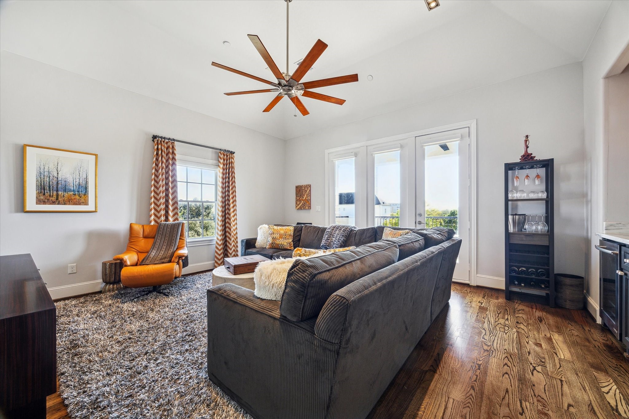 1619 Calumet Street Houston, TX 77004 - Photo 24 of 26 a living room with furniture and a wooden floor