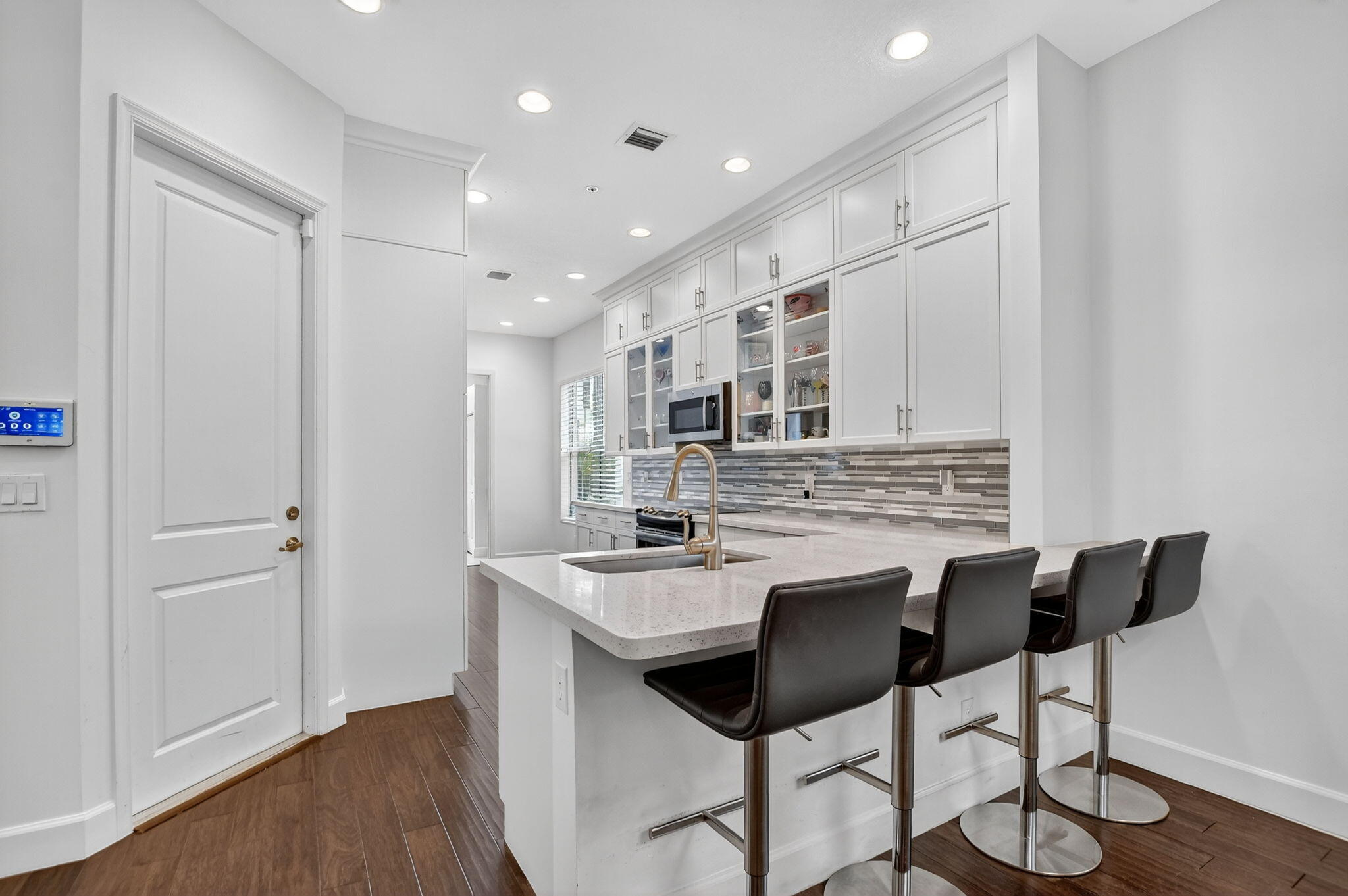 6675 Quiet Wave Trail Boca Raton, FL 33433 - Photo 12 of 65 a kitchen with stainless steel appliances granite countertop a sink and a refrigerator