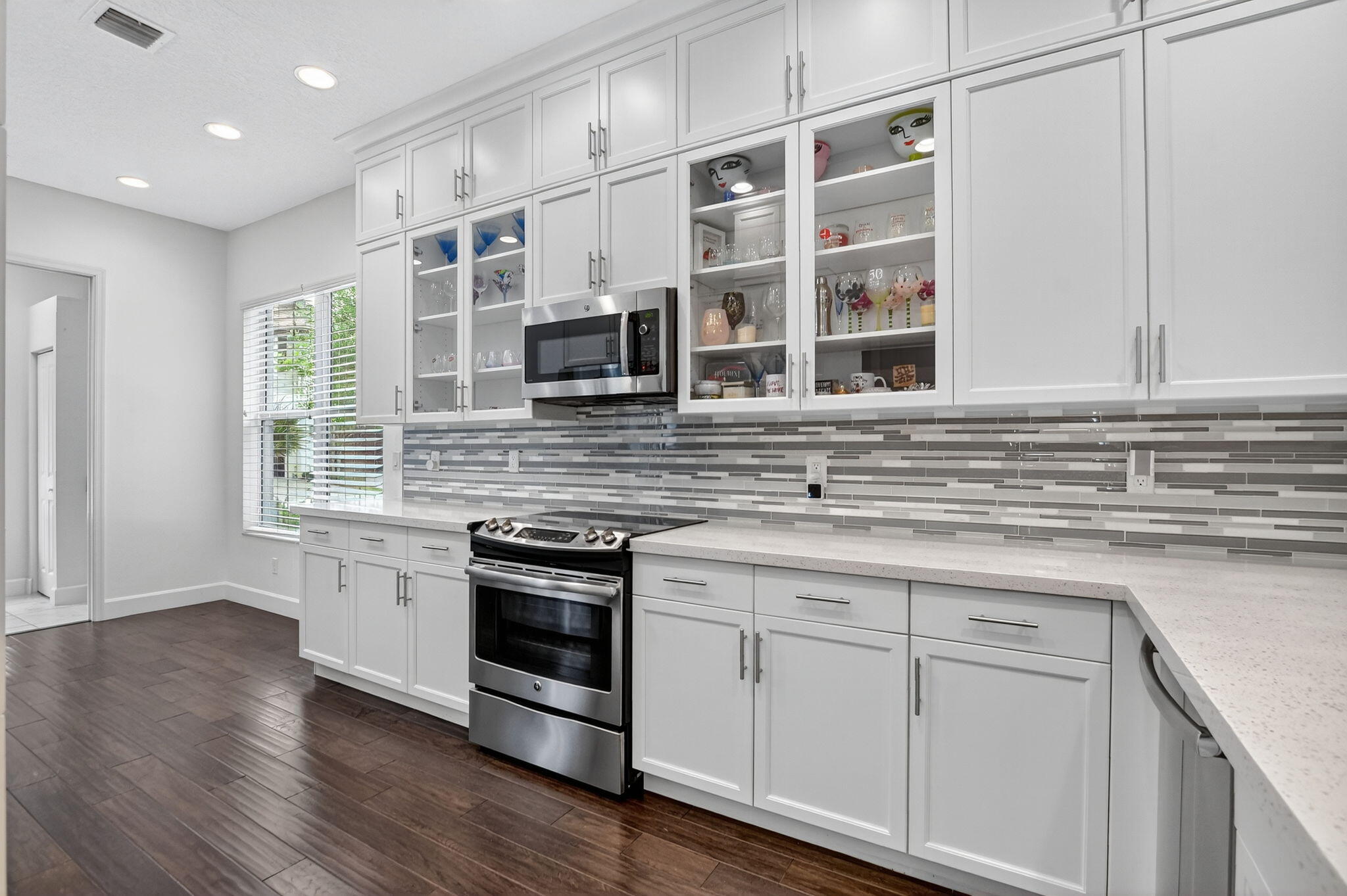 6675 Quiet Wave Trail Boca Raton, FL 33433 - Photo 13 of 65 a kitchen with stainless steel appliances granite countertop a stove and a sink