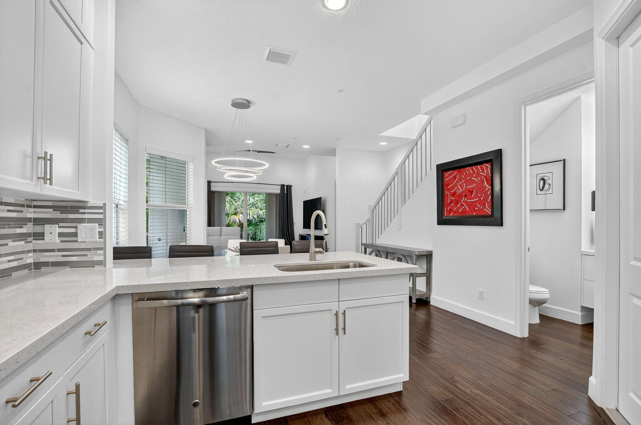 6675 Quiet Wave Trail Boca Raton, FL 33433 - Photo 14 of 65 a kitchen with a sink cabinets and wooden floor