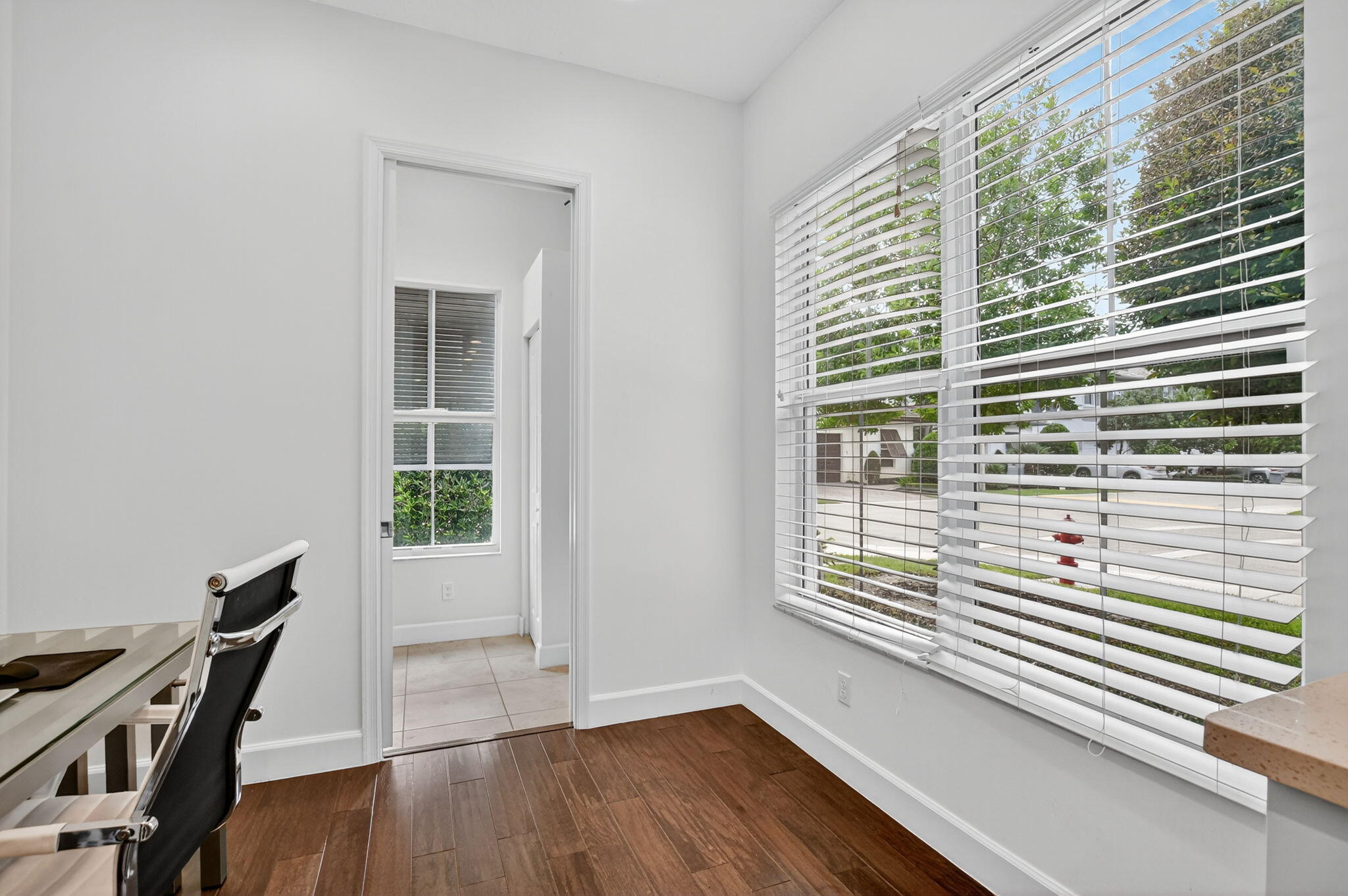 6675 Quiet Wave Trail Boca Raton, FL 33433 - Photo 17 of 65 a view of a room that has a window and wooden floor