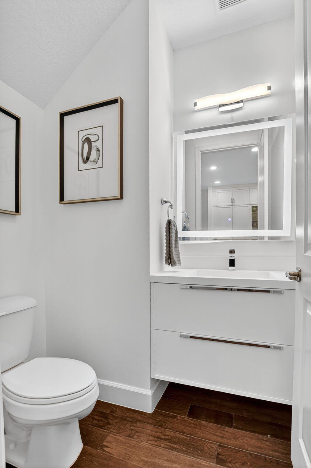 6675 Quiet Wave Trail Boca Raton, FL 33433 - Photo 23 of 65 a bathroom with a sink mirror and toilet
