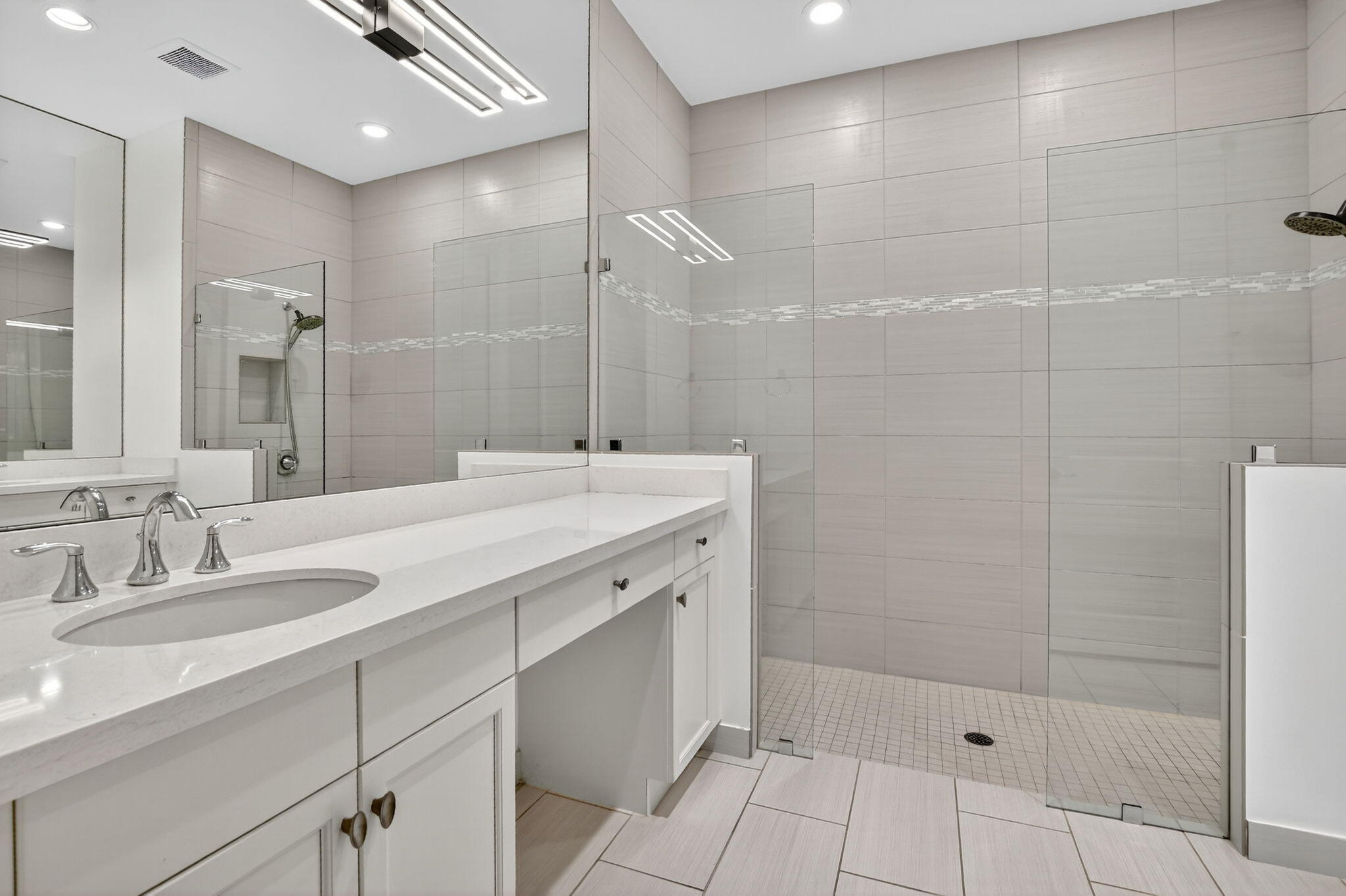 6675 Quiet Wave Trail Boca Raton, FL 33433 - Photo 28 of 65 a bathroom with a shower sink and mirror