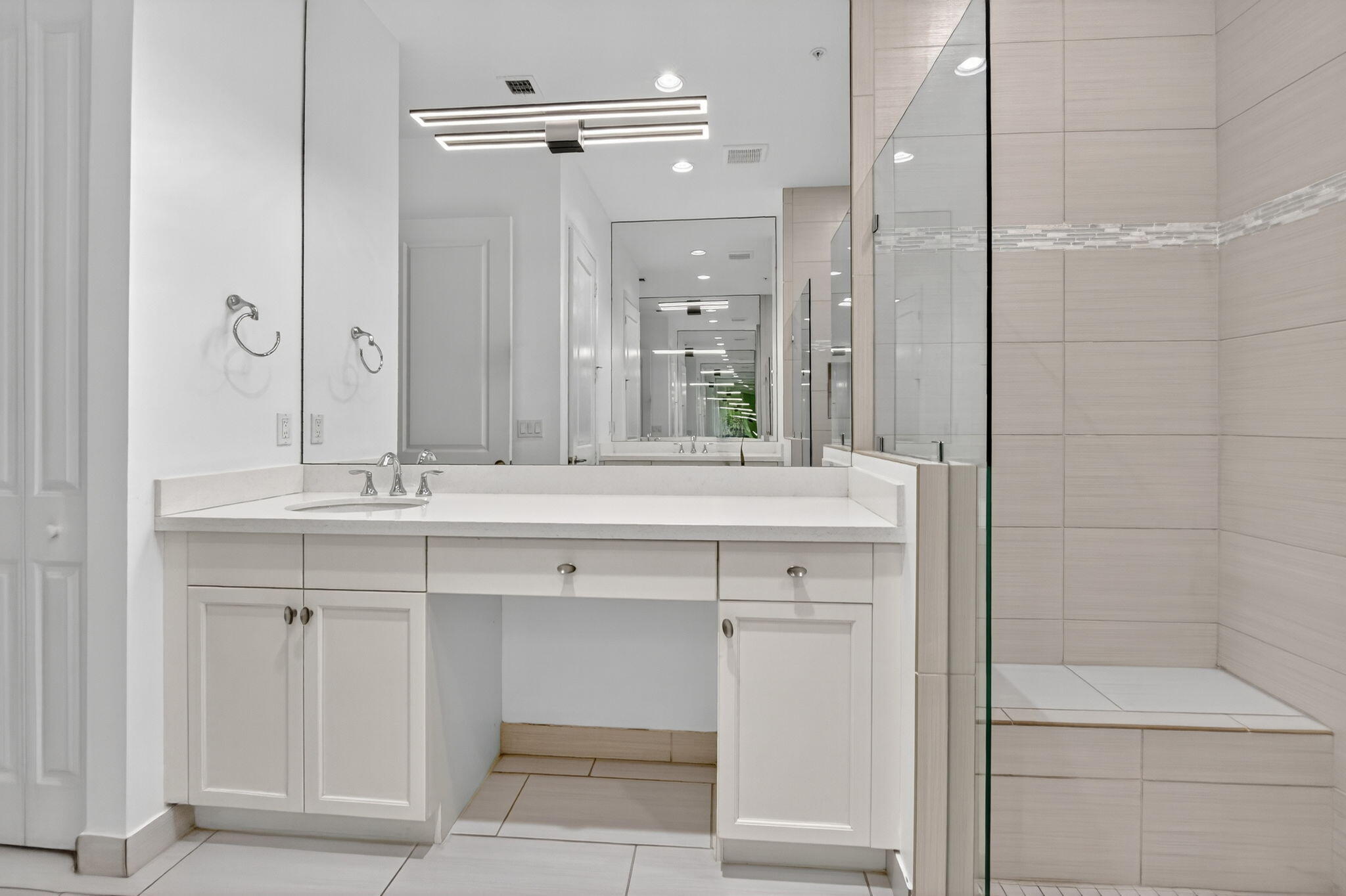 6675 Quiet Wave Trail Boca Raton, FL 33433 - Photo 30 of 65 a bathroom with a double vanity sink mirror and shower