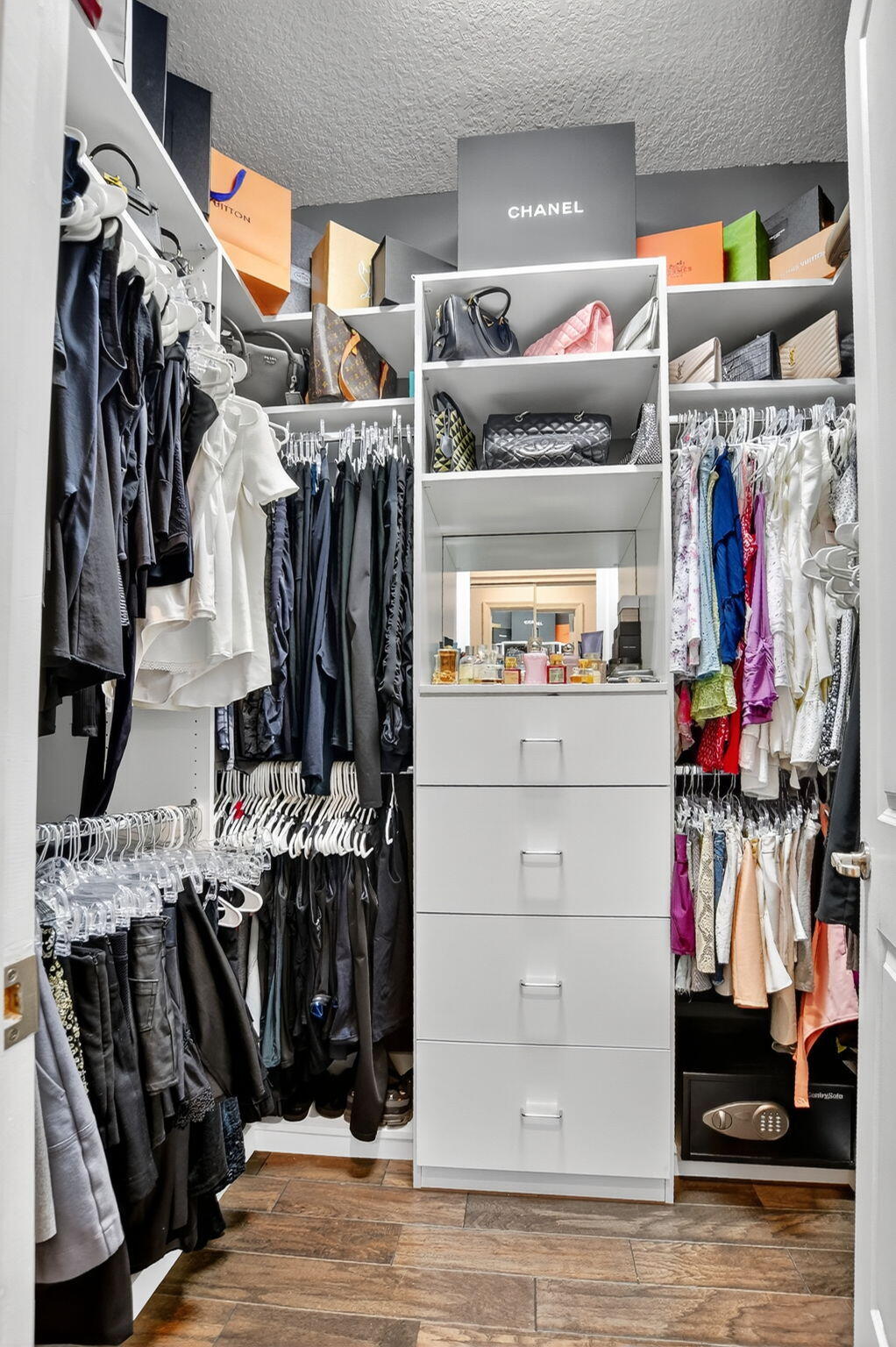 6675 Quiet Wave Trail Boca Raton, FL 33433 - Photo 31 of 65 a view of walk in closet with clothes and shoes
