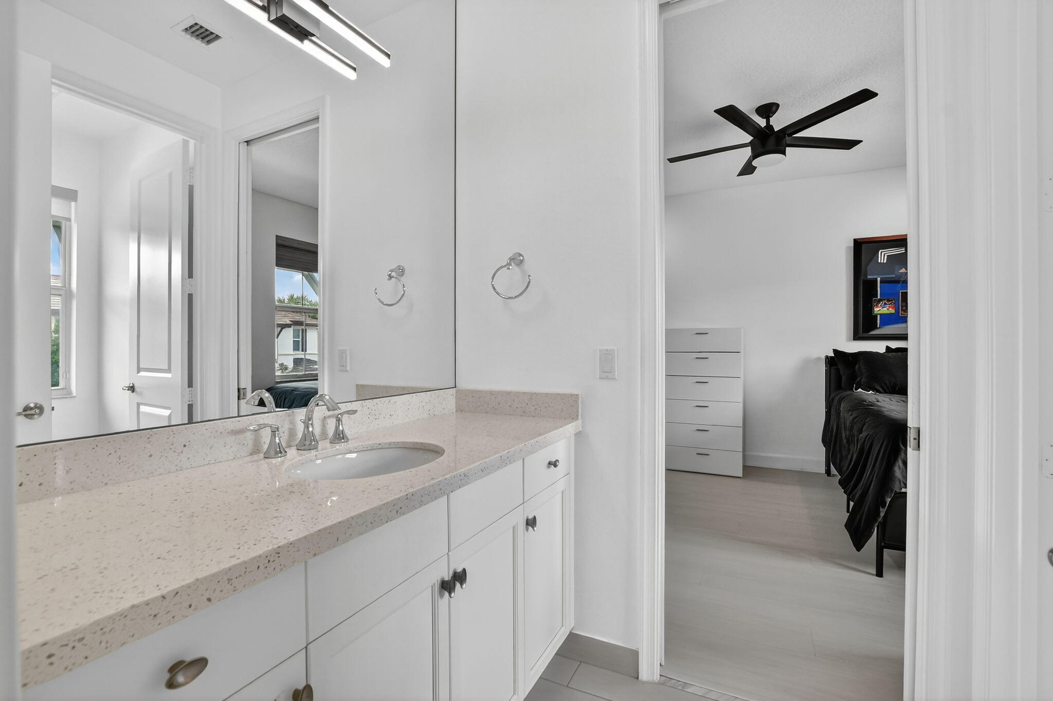 6675 Quiet Wave Trail Boca Raton, FL 33433 - Photo 37 of 65 a en suite bathroom with a granite countertop sink mirror and bathtub