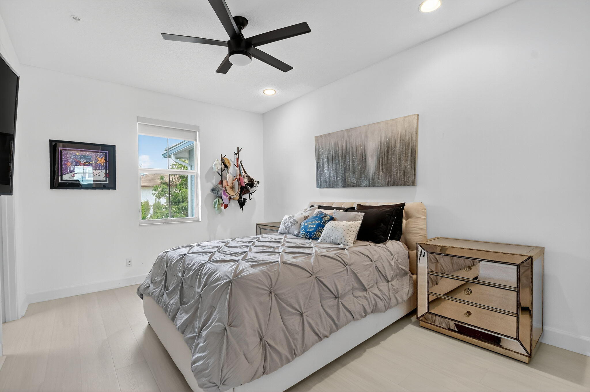 6675 Quiet Wave Trail Boca Raton, FL 33433 - Photo 43 of 65 a bedroom with a bed and a painting on the wall