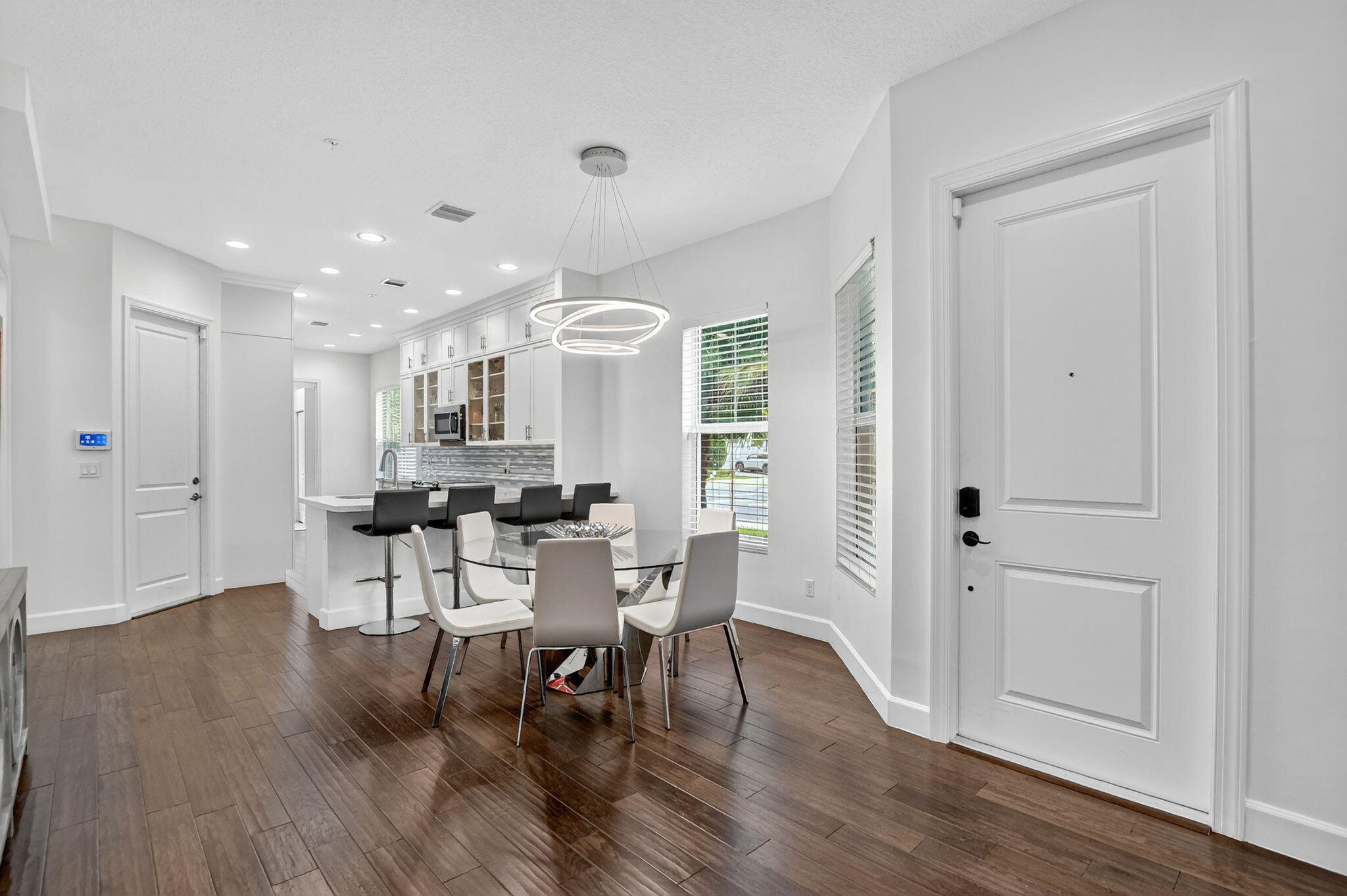 6675 Quiet Wave Trail Boca Raton, FL 33433 - Photo 5 of 65 a view of a dining room with furniture and wooden floor