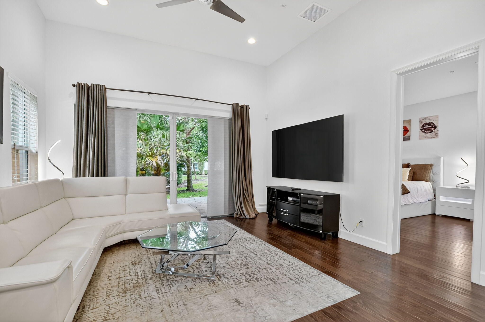 6675 Quiet Wave Trail Boca Raton, FL 33433 - Photo 7 of 65 a living room with furniture and a flat screen tv