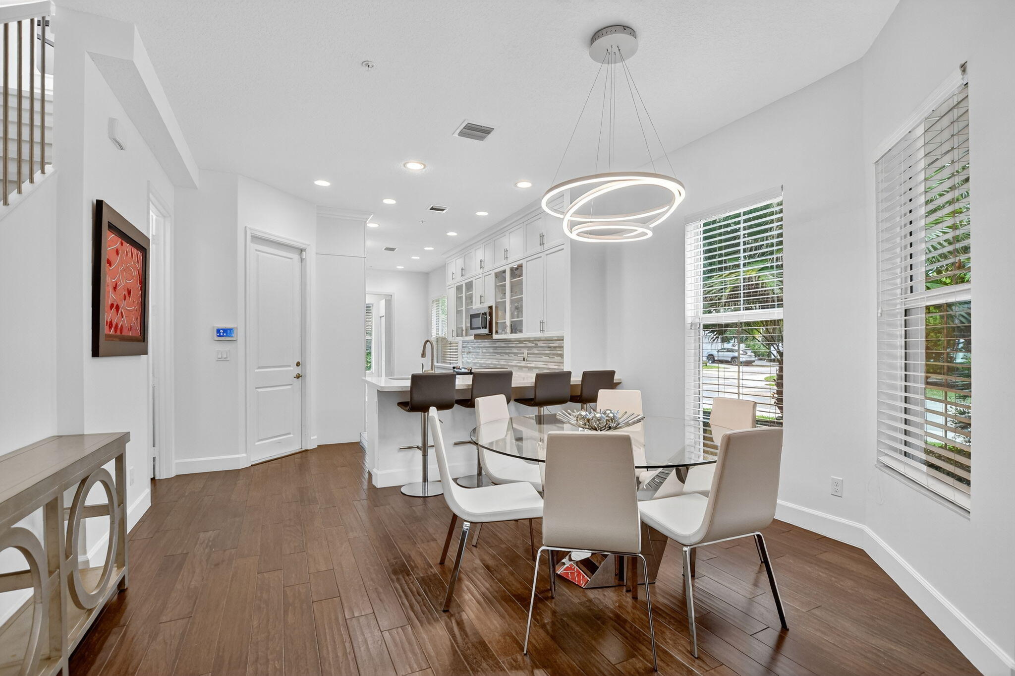 6675 Quiet Wave Trail Boca Raton, FL 33433 - Photo 10 of 65 a view of a dining room with furniture window and wooden floor
