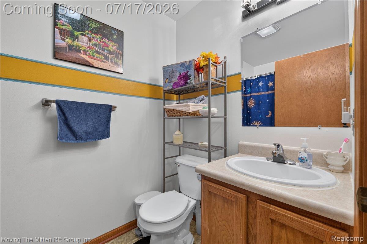 40162 Alden Road Belleville, MI 48111 - Photo 25 of 67 Bathroom vanity with a laminate countertop and an integrated white basin