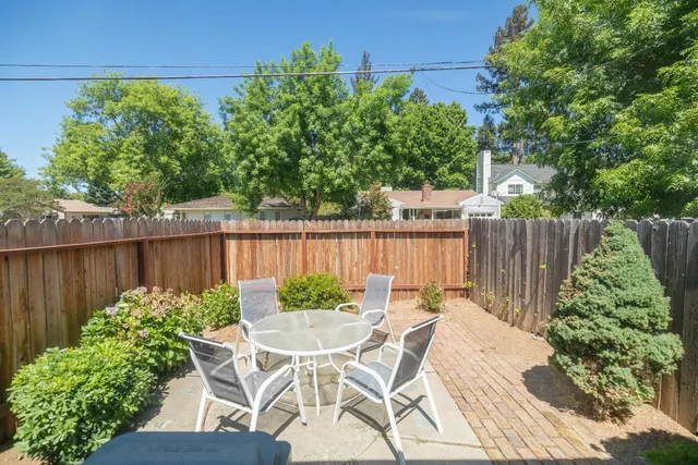 a view of a backyard with a garden and plants