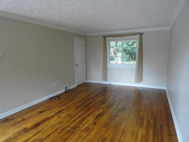 1506 Radford Road Pittsburgh, PA 15227 - Photo 4 of 24 Living Room is 21x12, tons of entertaining room, huge (and new) windows give you tons of natural lighting.