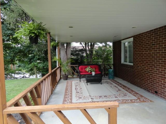 1506 Radford Road Pittsburgh, PA 15227 - Photo 10 of 24 Wonderful Backyard...level, deep, private, quiet, and check out the size of this Porch...tons of entertaining room and perfect for little ones and pooches.