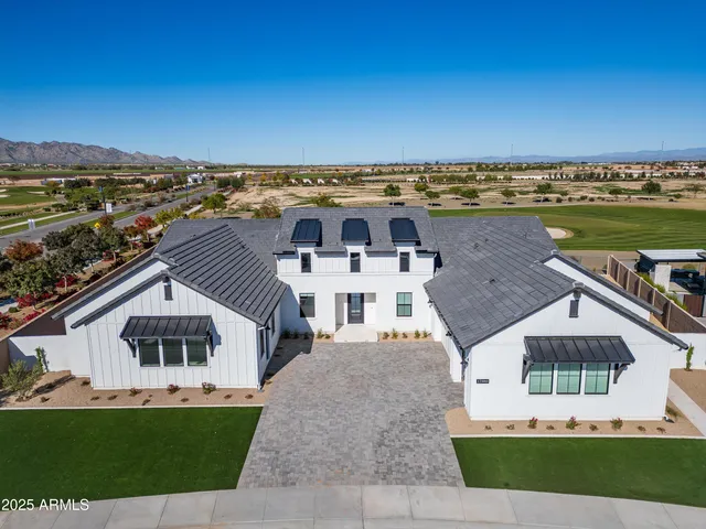 an aerial view of a house with a garden