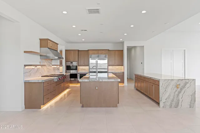 a kitchen with counter top space sink and center