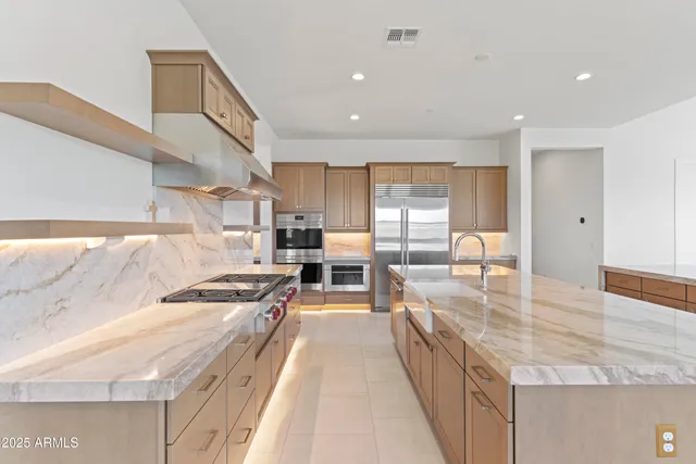 a stove top oven sitting inside of a kitchen