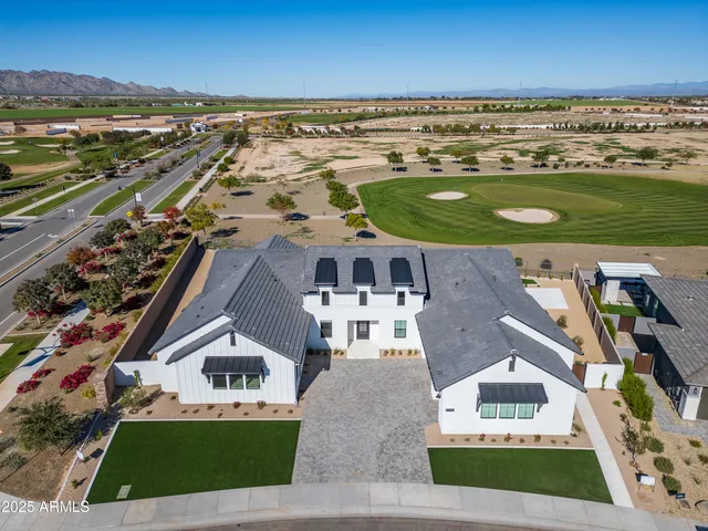 an aerial view of a house with a outdoor space