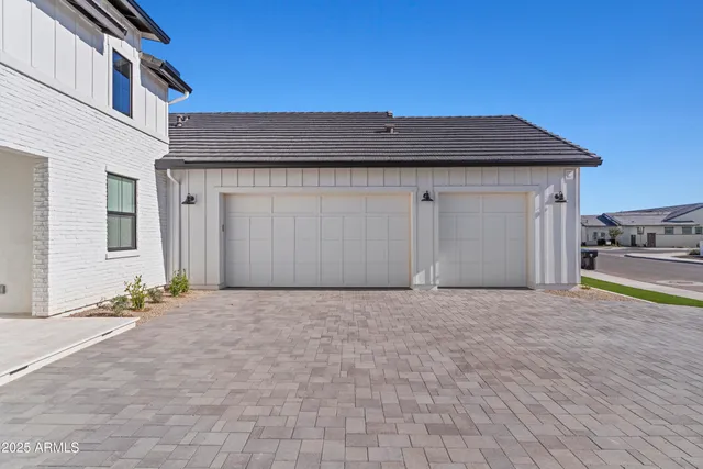 a view of an house with backyard and road