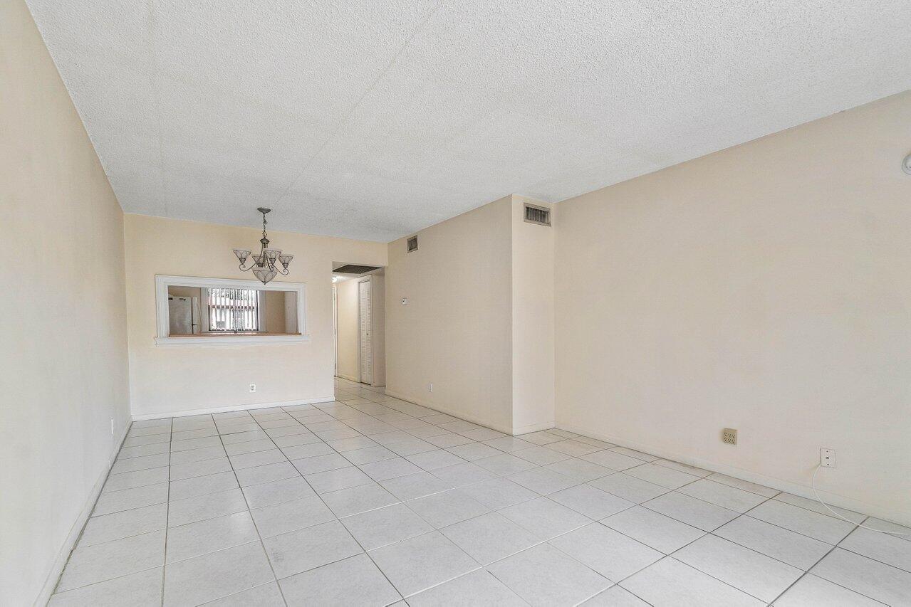 6736 Palmetto Circle South, Unit 105 Boca Raton, FL 33433 - Photo 12 of 28 a view of an empty room