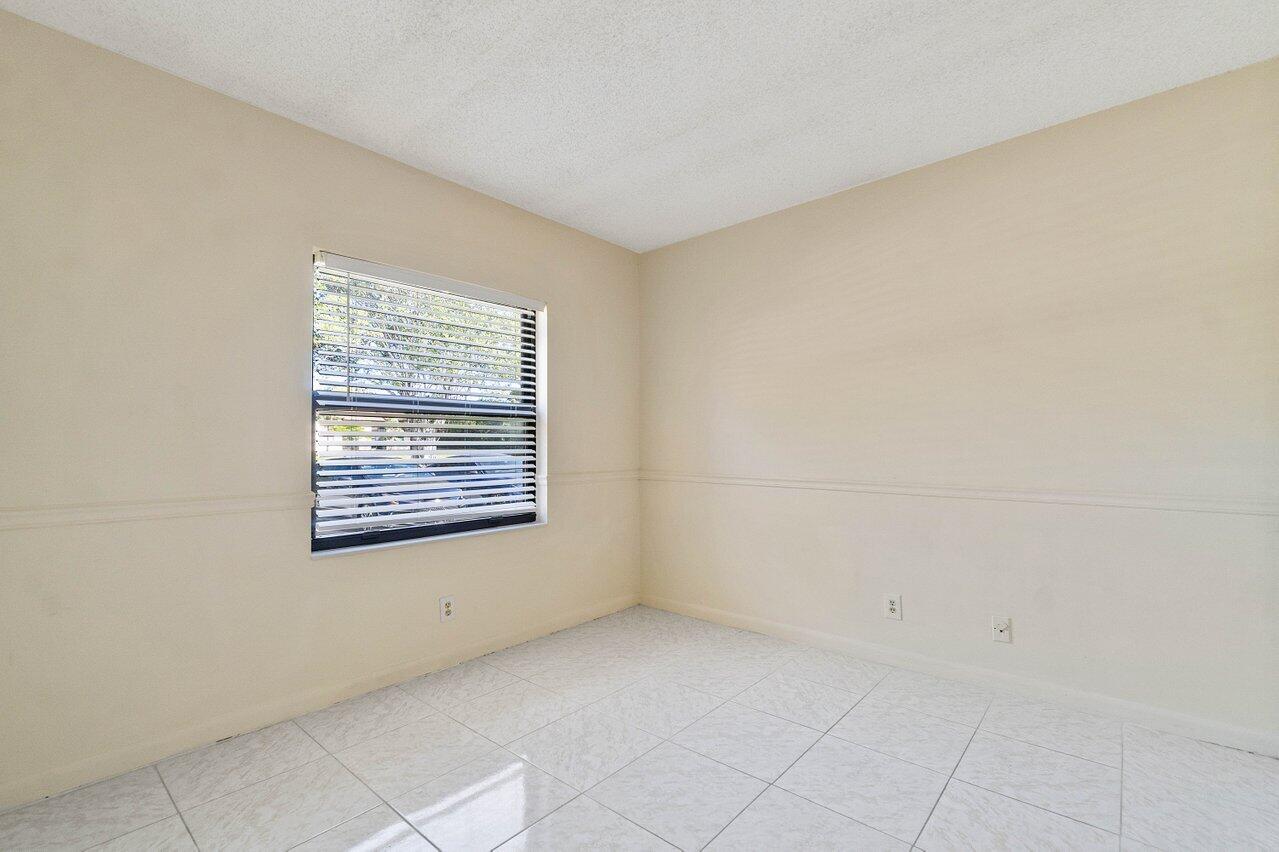 6736 Palmetto Circle South, Unit 105 Boca Raton, FL 33433 - Photo 13 of 28 a view of a room that has a window in it