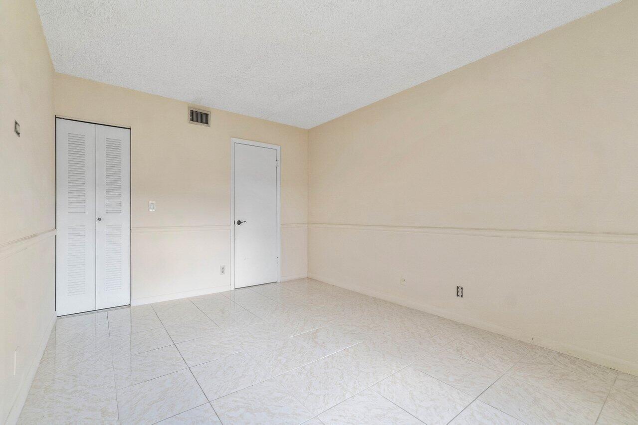 6736 Palmetto Circle South, Unit 105 Boca Raton, FL 33433 - Photo 16 of 28 a view of an empty room