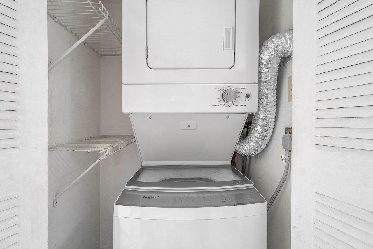 6736 Palmetto Circle South, Unit 105 Boca Raton, FL 33433 - Photo 20 of 28 a utility room with washer and dryer