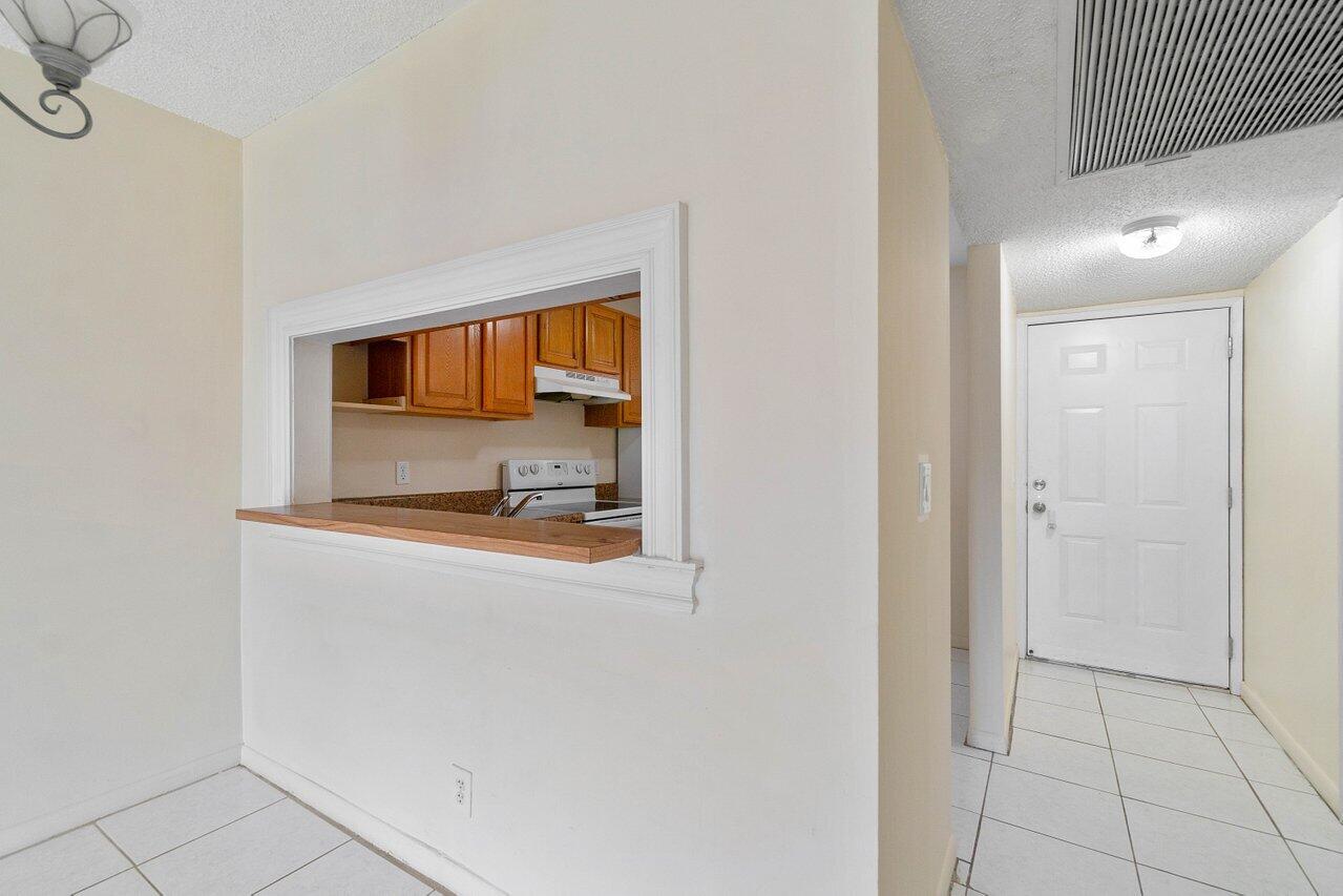 6736 Palmetto Circle South, Unit 105 Boca Raton, FL 33433 - Photo 3 of 28 a bathroom with a sink and a mirror
