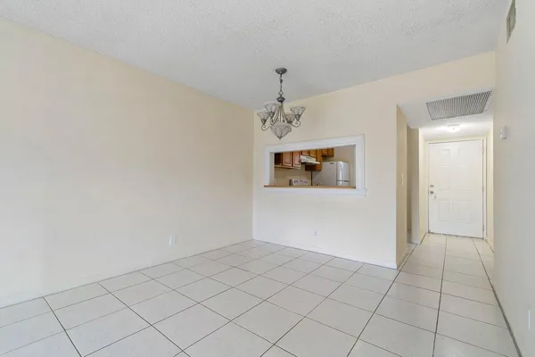 an empty room with a hallway