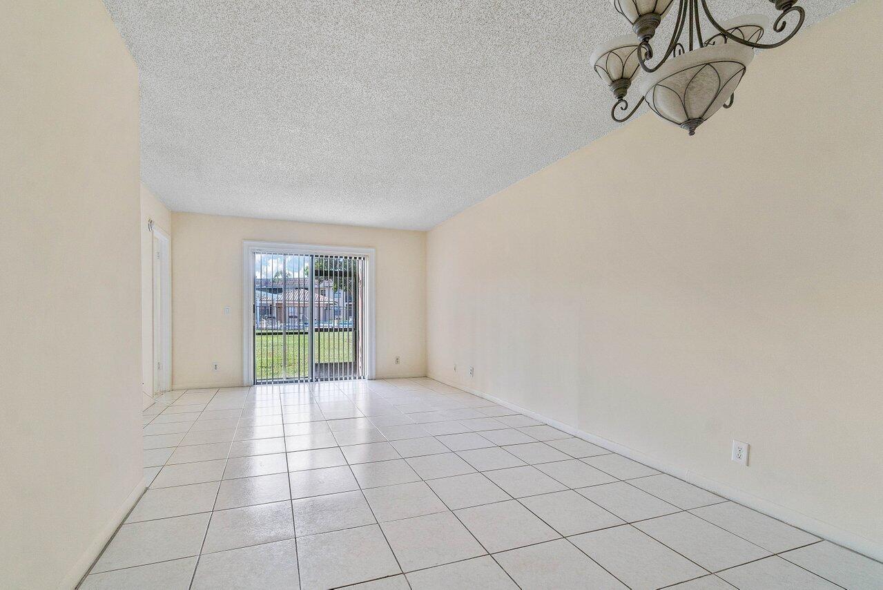6736 Palmetto Circle South, Unit 105 Boca Raton, FL 33433 - Photo 9 of 28 a view of an empty room and window