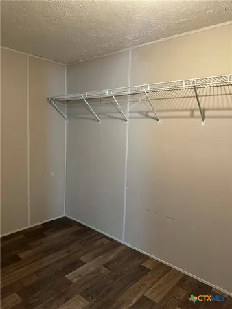 a view of a room with racks on the wall