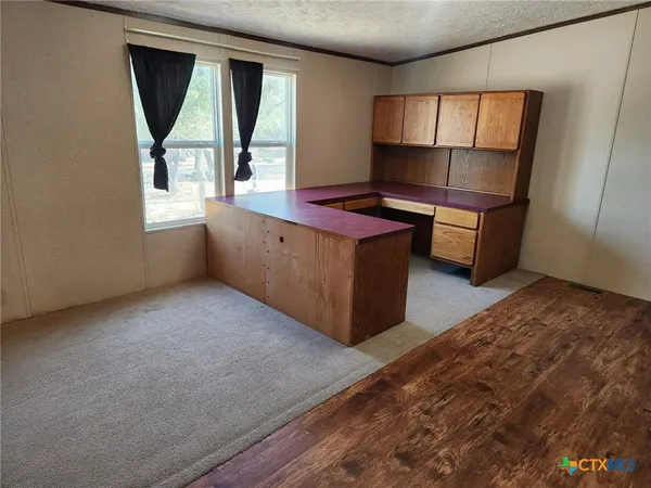 a kitchen with sink and window