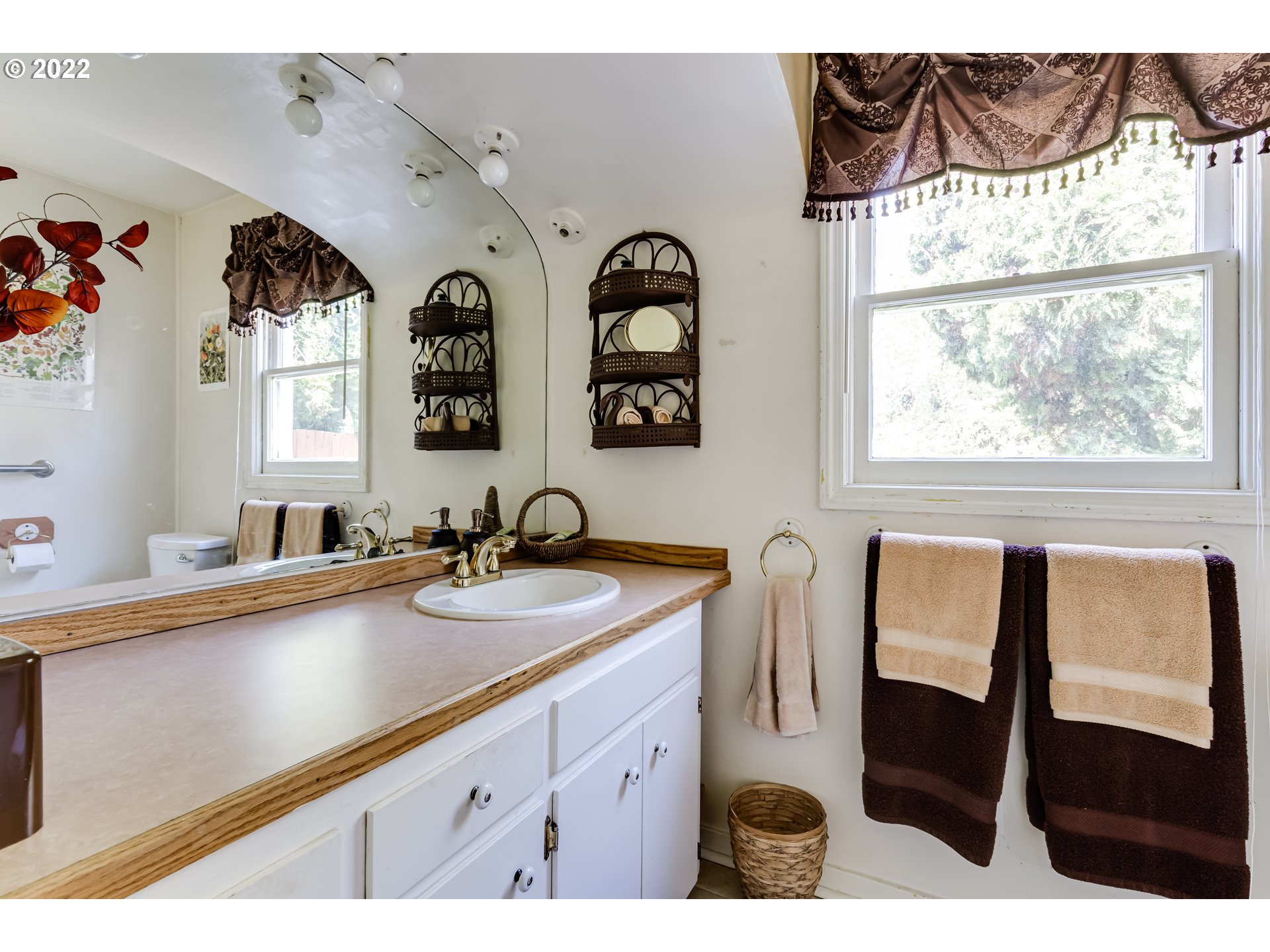 369 Knoop Lane Eugene, OR 97404 - Photo 23 of 32 a bathroom with a double vanity sink and a window
