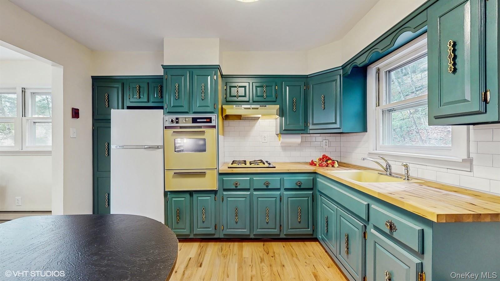 736 State Rte 55 Napanoch, NY 12458 - Photo 3 of 49 Kitchen featuring green cabinetry with wooden counters
