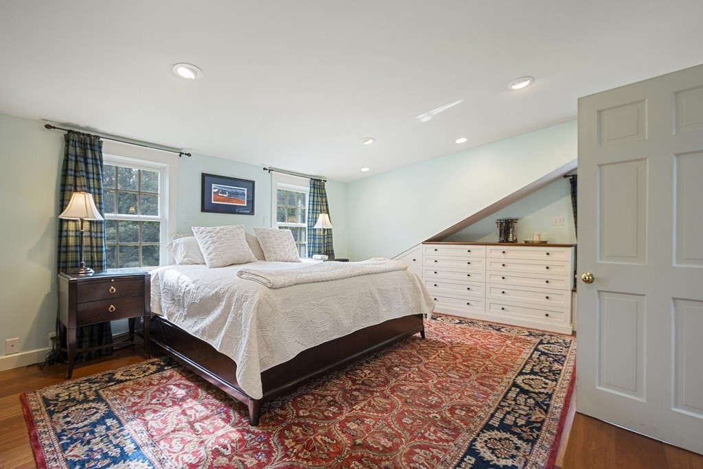 49 Parker Street Lexington, MA 02421 - Photo 15 of 42 a bedroom with a large bed and a rug