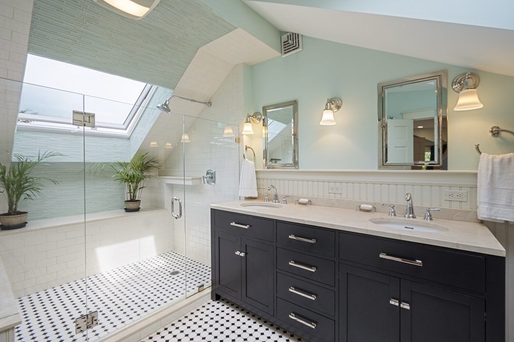 49 Parker Street Lexington, MA 02421 - Photo 17 of 42 a spacious bathroom with a double vanity sink a mirror and a shower