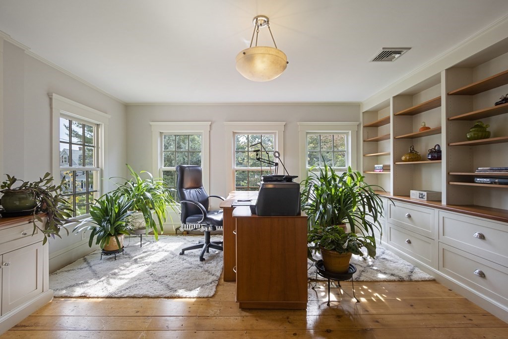 49 Parker Street Lexington, MA 02421 - Photo 24 of 42 a living room with furniture potted plant and window