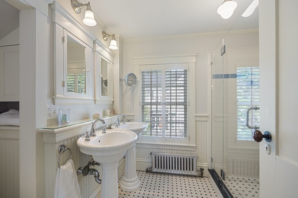 49 Parker Street Lexington, MA 02421 - Photo 26 of 42 a bathroom with a sink a toilet and shower