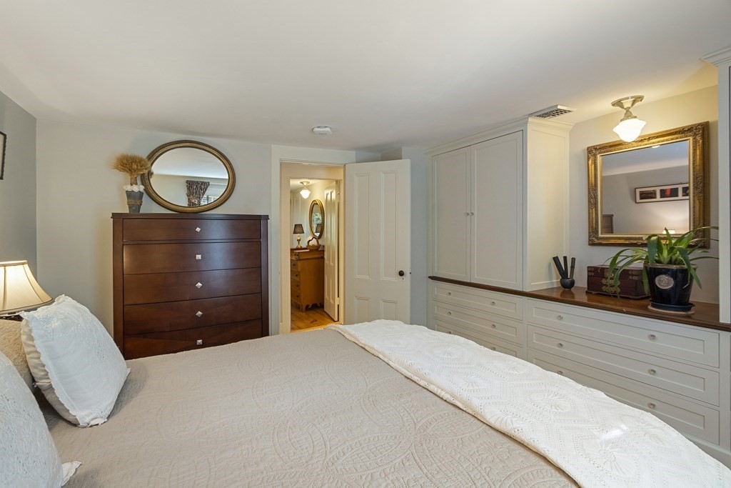 49 Parker Street Lexington, MA 02421 - Photo 28 of 42 a bedroom with a bed and a dresser