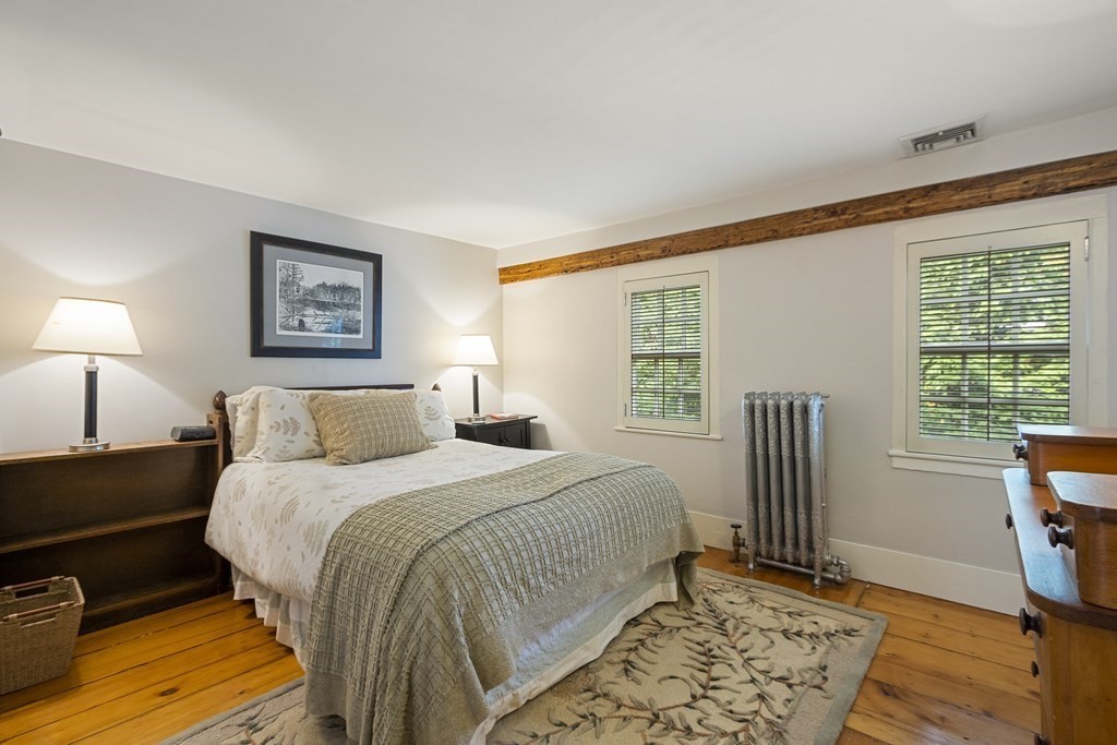 49 Parker Street Lexington, MA 02421 - Photo 30 of 42 a bedroom with a bed and a window