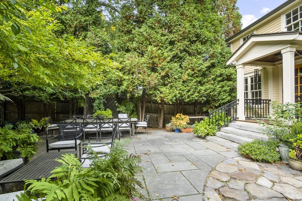 49 Parker Street Lexington, MA 02421 - Photo 34 of 42 a view of a house with backyard sitting area and garden