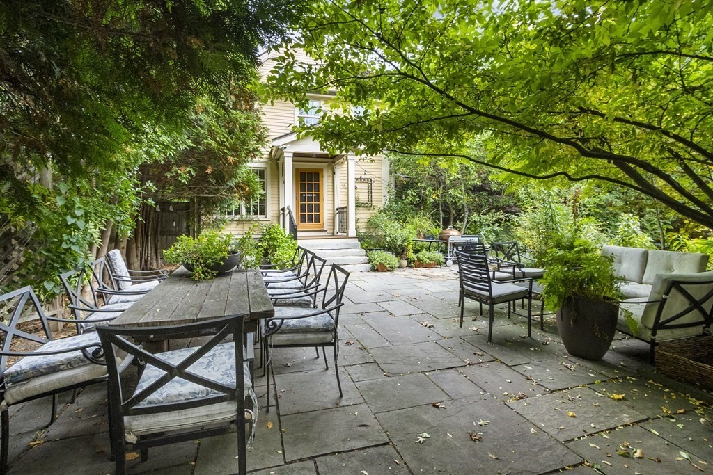 49 Parker Street Lexington, MA 02421 - Photo 35 of 42 a view of a patio with table and chairs and potted plants