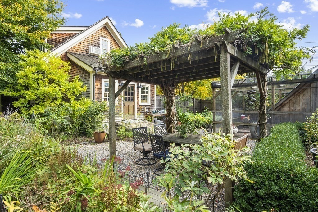 49 Parker Street Lexington, MA 02421 - Photo 37 of 42 a view of patio with a table and chairs and potted plants