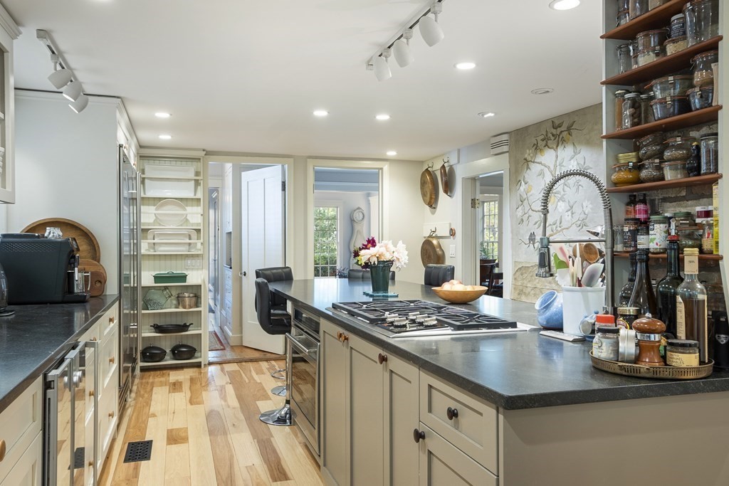 49 Parker Street Lexington, MA 02421 - Photo 9 of 42 a kitchen with stainless steel appliances granite countertop a stove and a sink