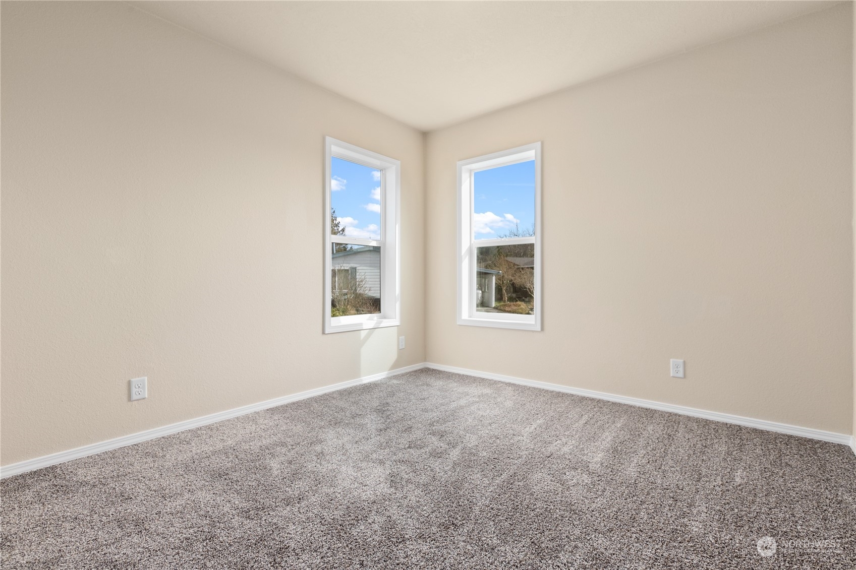 4701 Devonshire Drive Anacortes, WA 98221 - Photo 11 of 24 an empty room with windows