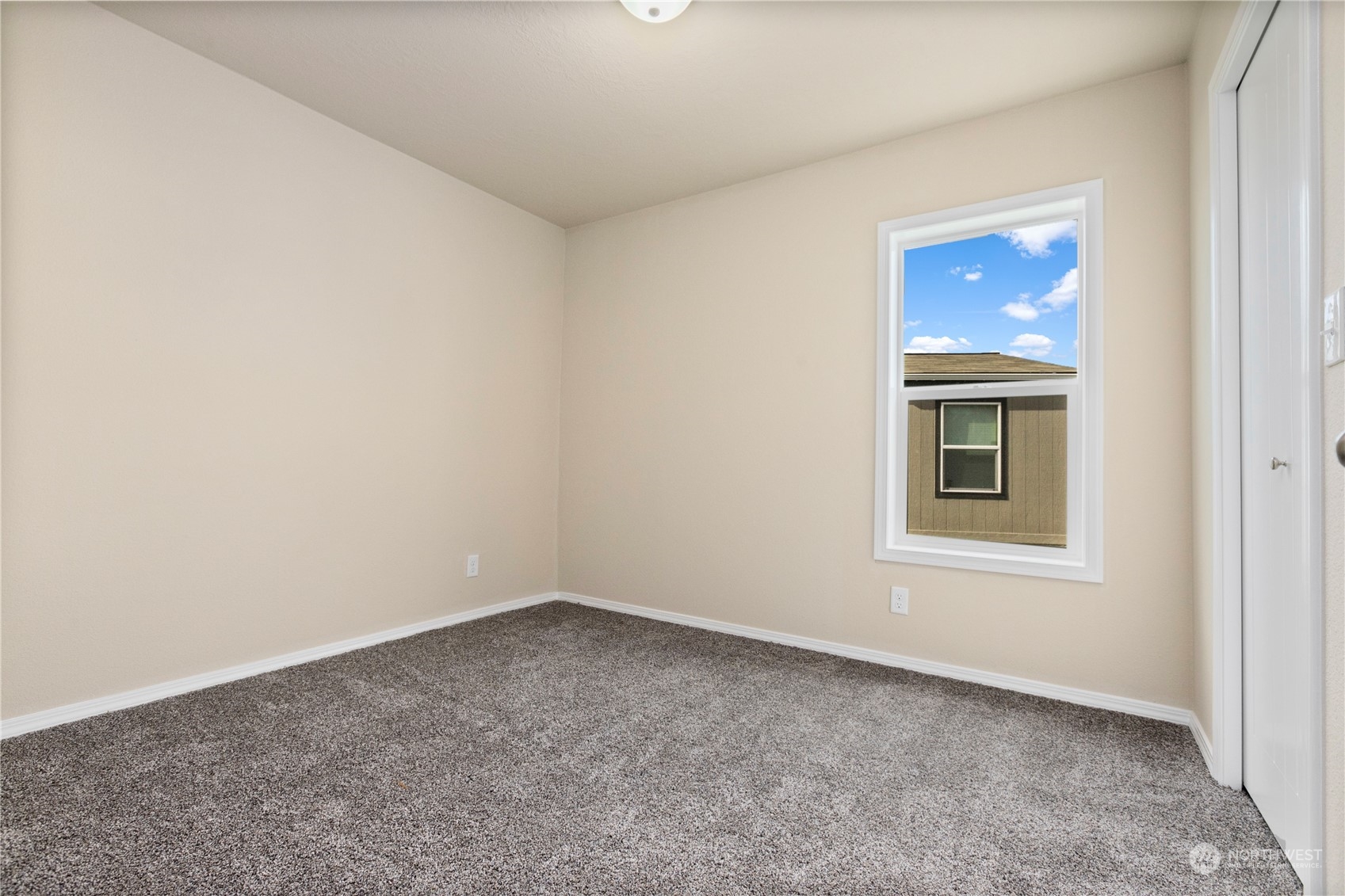 4701 Devonshire Drive Anacortes, WA 98221 - Photo 12 of 24 an empty room with a window