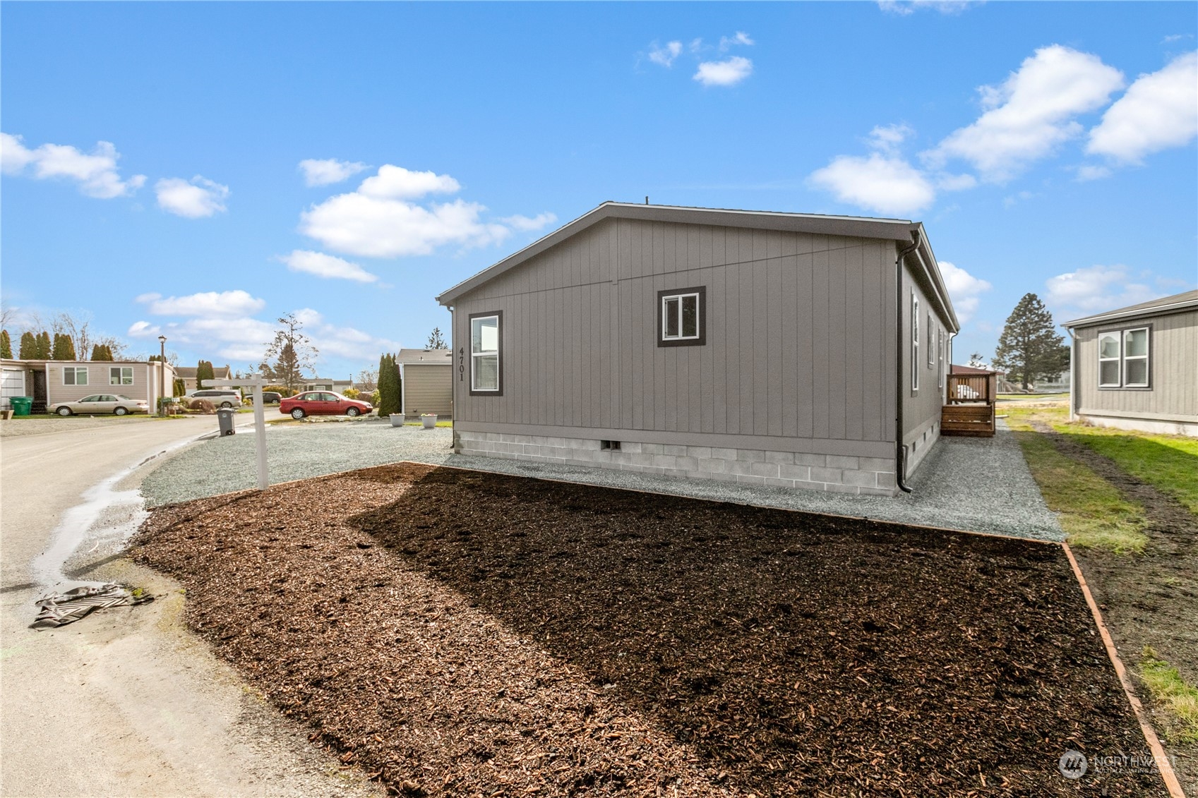 4701 Devonshire Drive Anacortes, WA 98221 - Photo 16 of 24 a view of a house with a yard