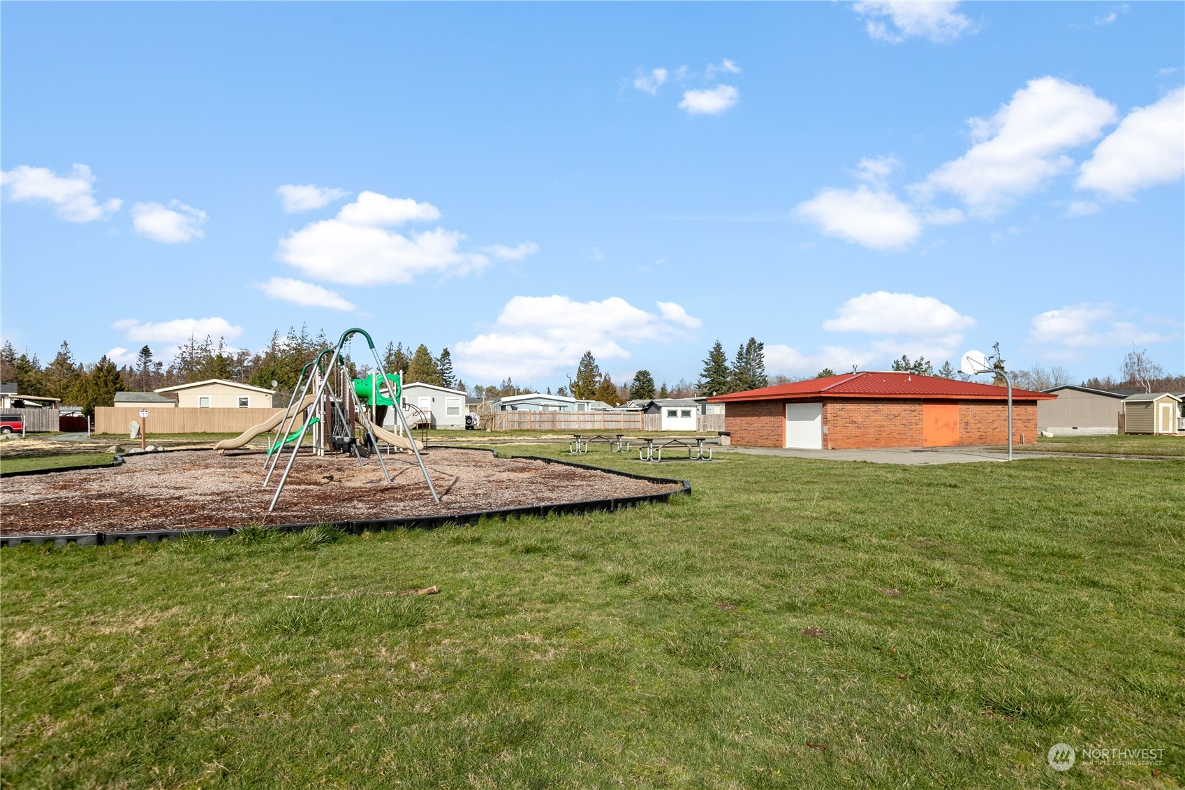 4701 Devonshire Drive Anacortes, WA 98221 - Photo 19 of 24 a view of a garden and swimming pool